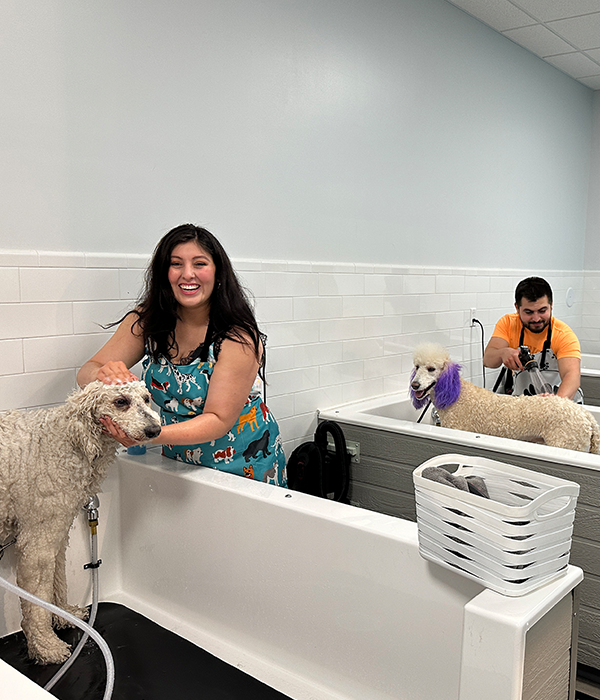 mom with dog in self-wash at pet store